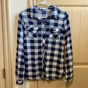 Blue and white checked woman’s flannel.